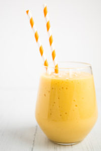 coconut mango smoothie in a glass